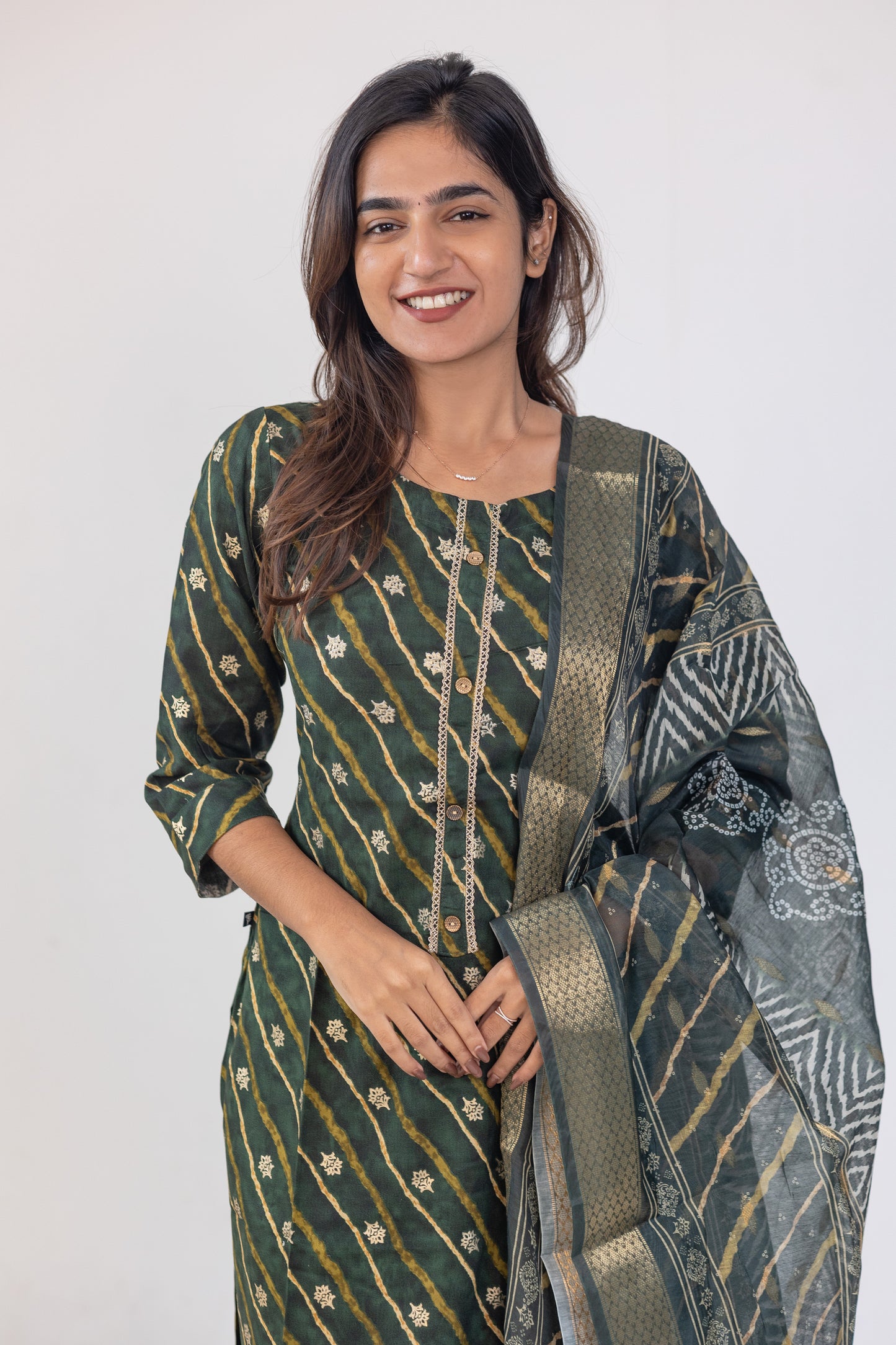 Poonguzhali salwar set in dark green