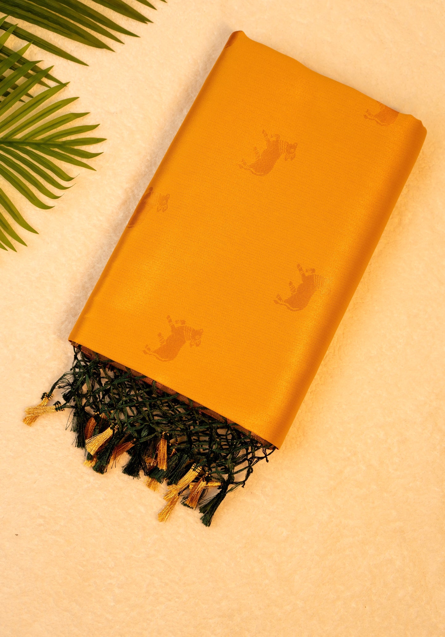Designer saree in Mustard Yellow with Green Zari Border