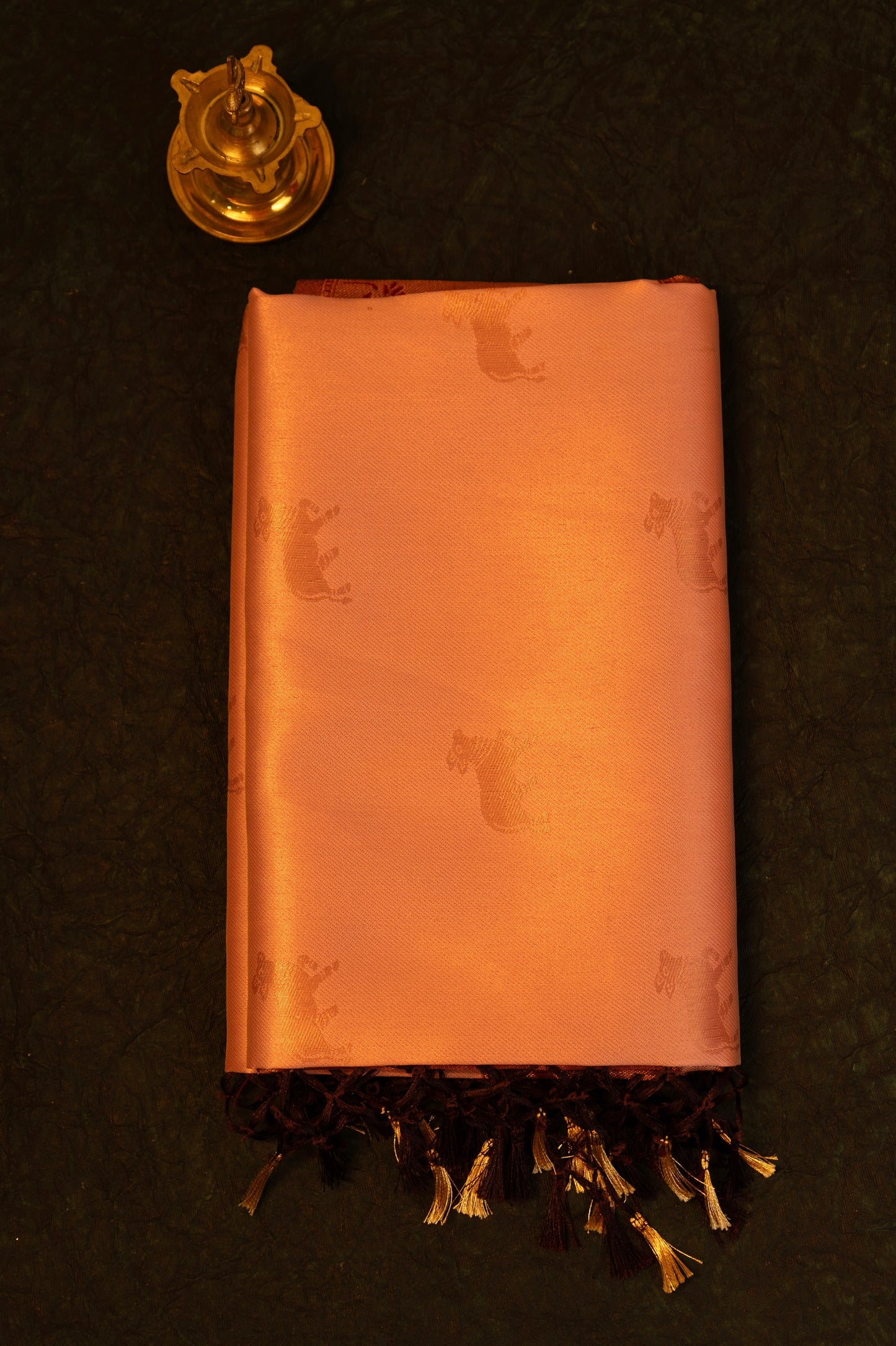 Designer saree in Peach with Maroon Zari Border