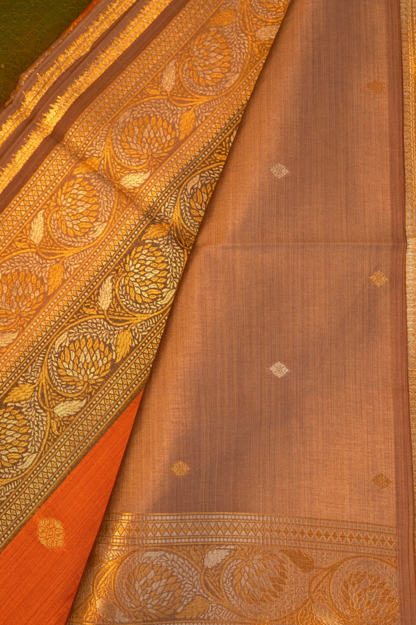 Soft silk saree in orange with Gold Zari Border