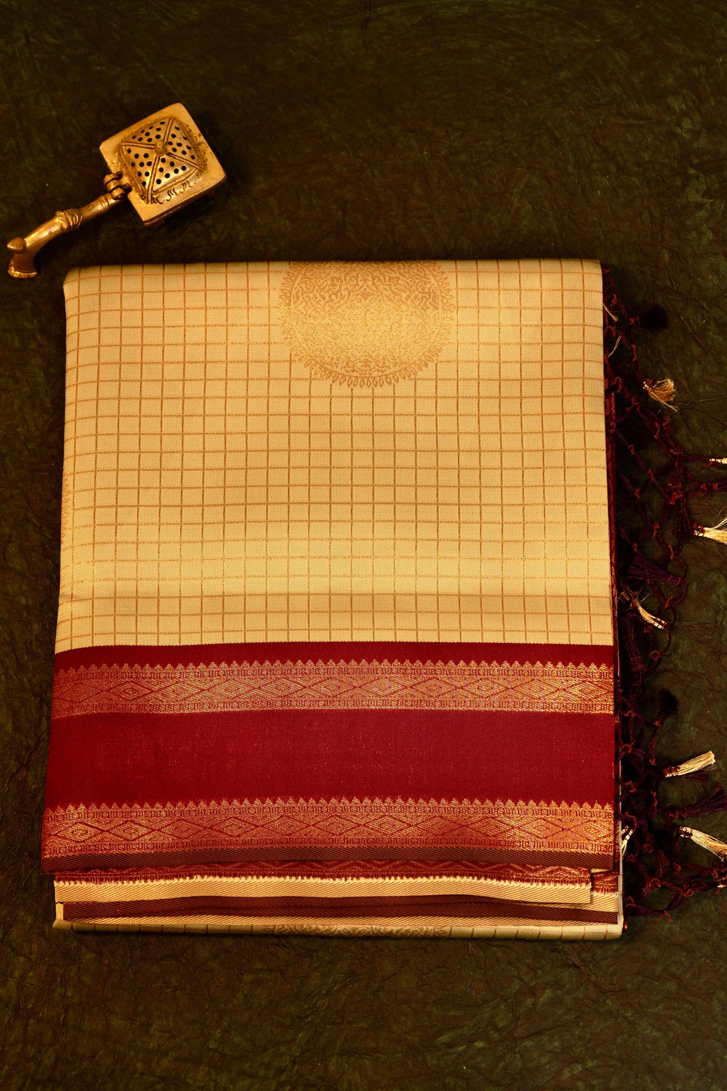 Designer saree in pale yellow with gold zari