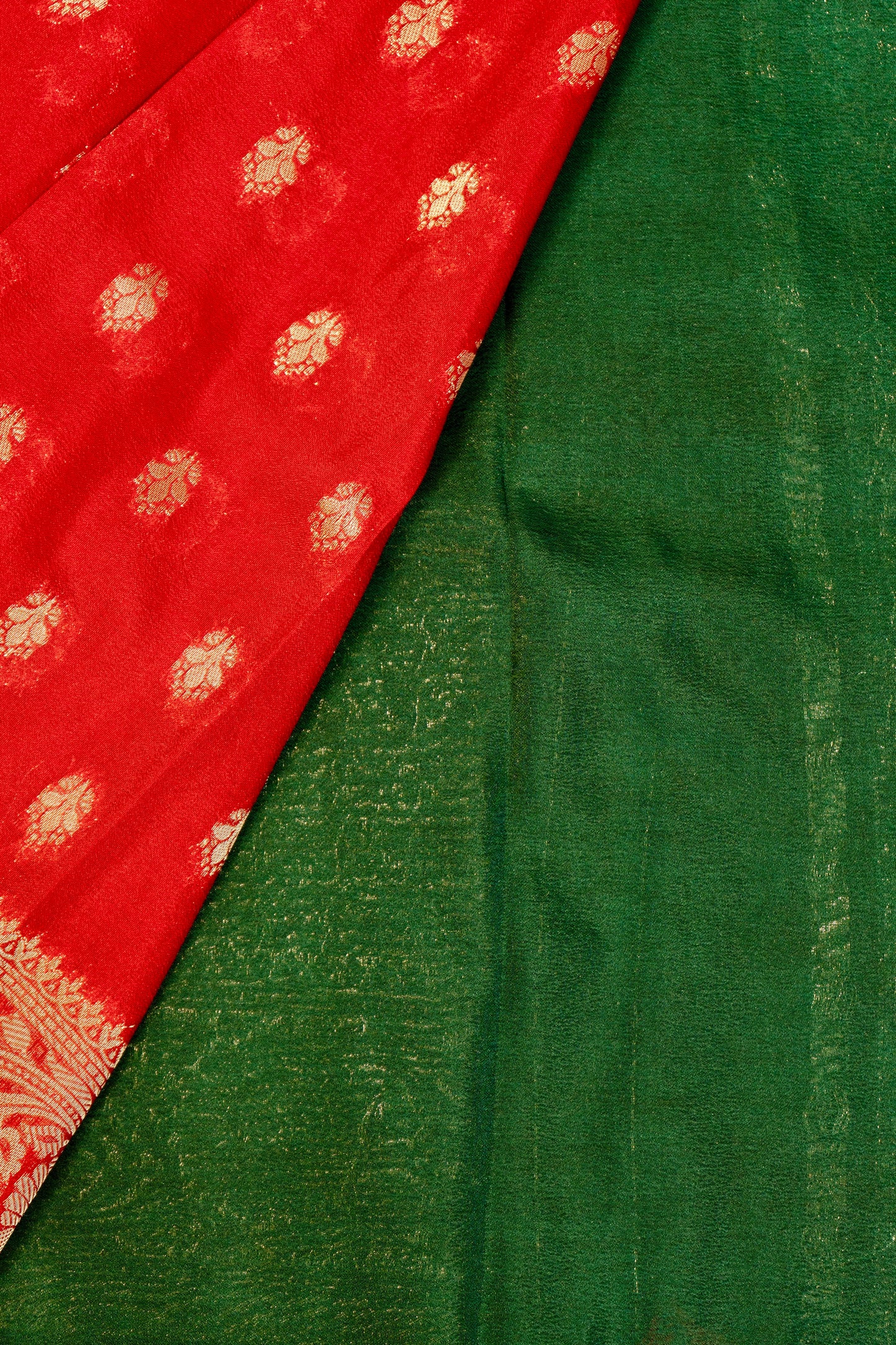 Designer saree in red with woven green motifs