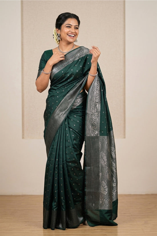 Bottle green Belgaum silk saree with a Vaira Oosi border