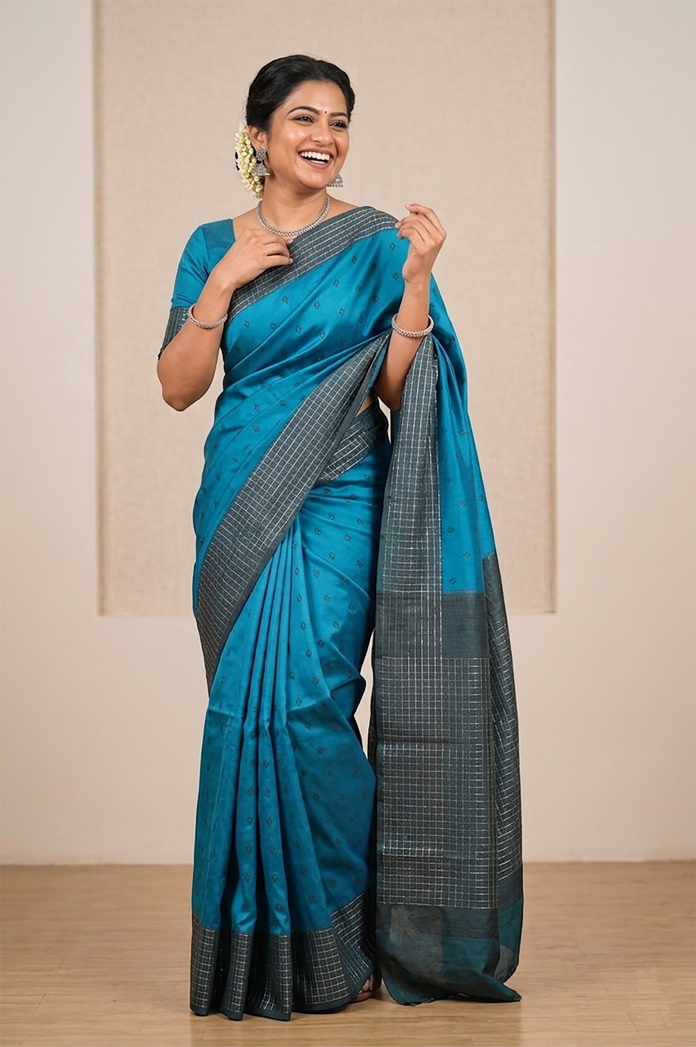 Peacock blue Belgaum silk saree with a Vaira Oosi border