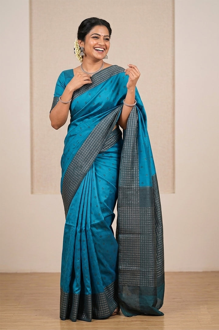 Peacock blue Belgaum silk saree with a Vaira Oosi border