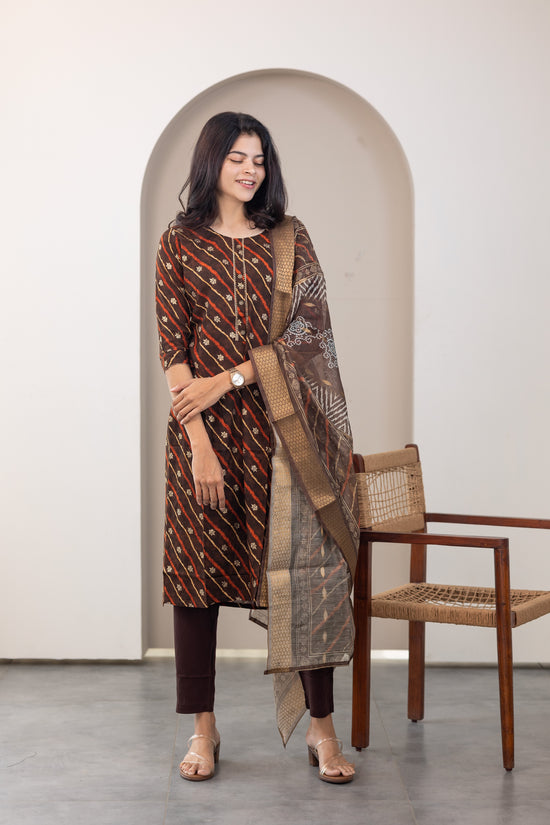 Poonguzhali salwar set in dark brown with gold printed design