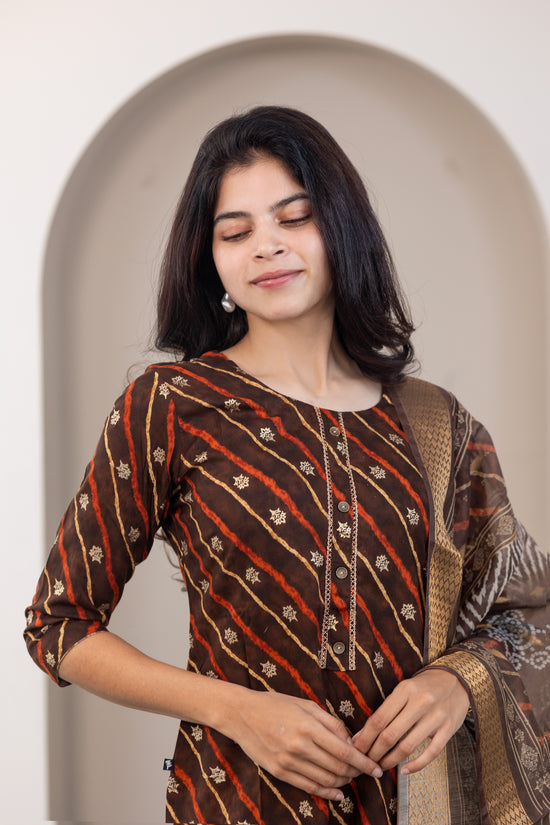 Poonguzhali salwar set in dark brown with gold printed design