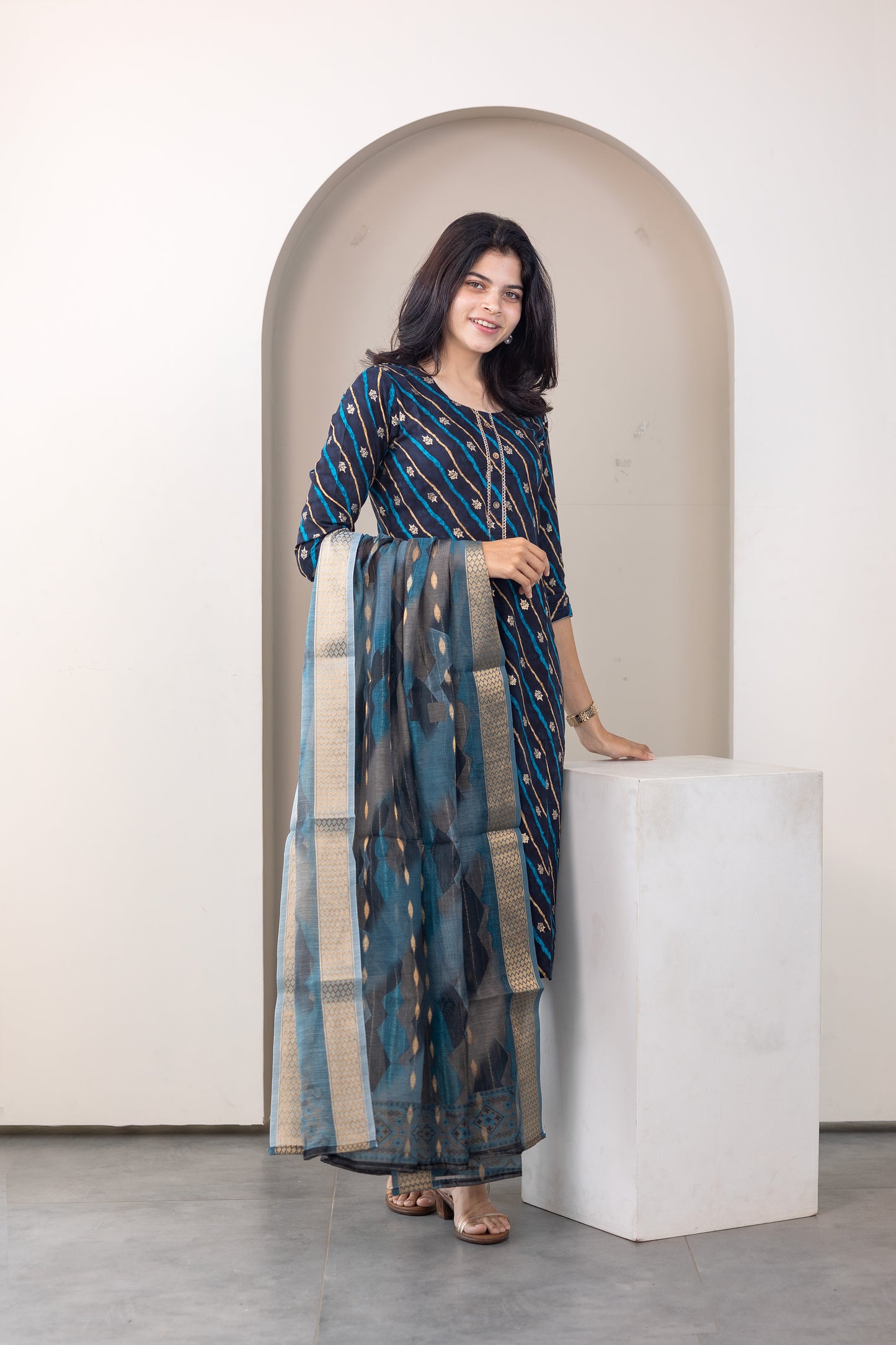 Poonguzhali salwar set in blue with gold printed design
