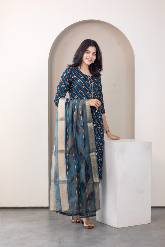Poonguzhali salwar set in blue with gold printed design