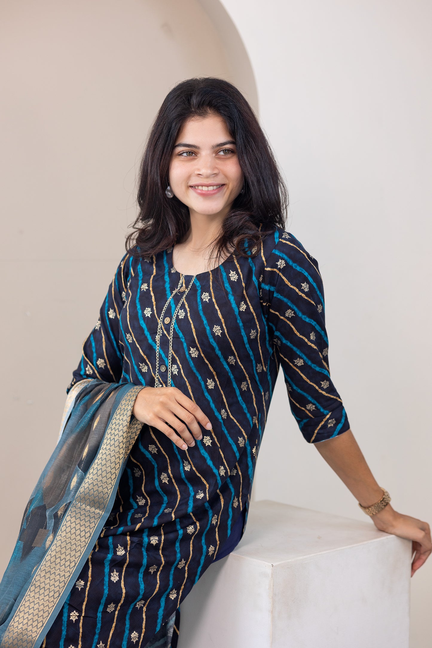 Poonguzhali salwar set in blue with gold printed design