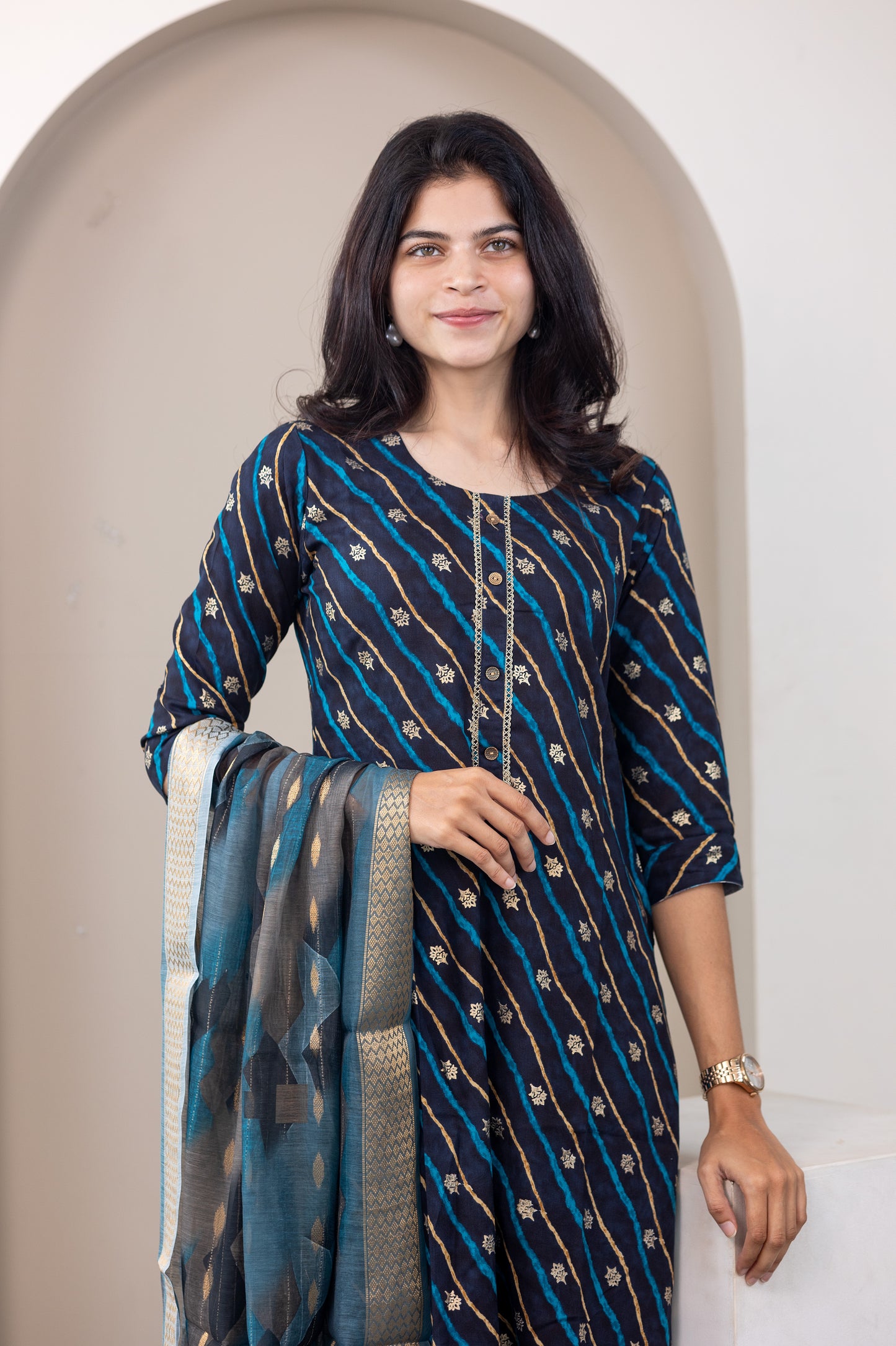 Poonguzhali salwar set in blue with gold printed design