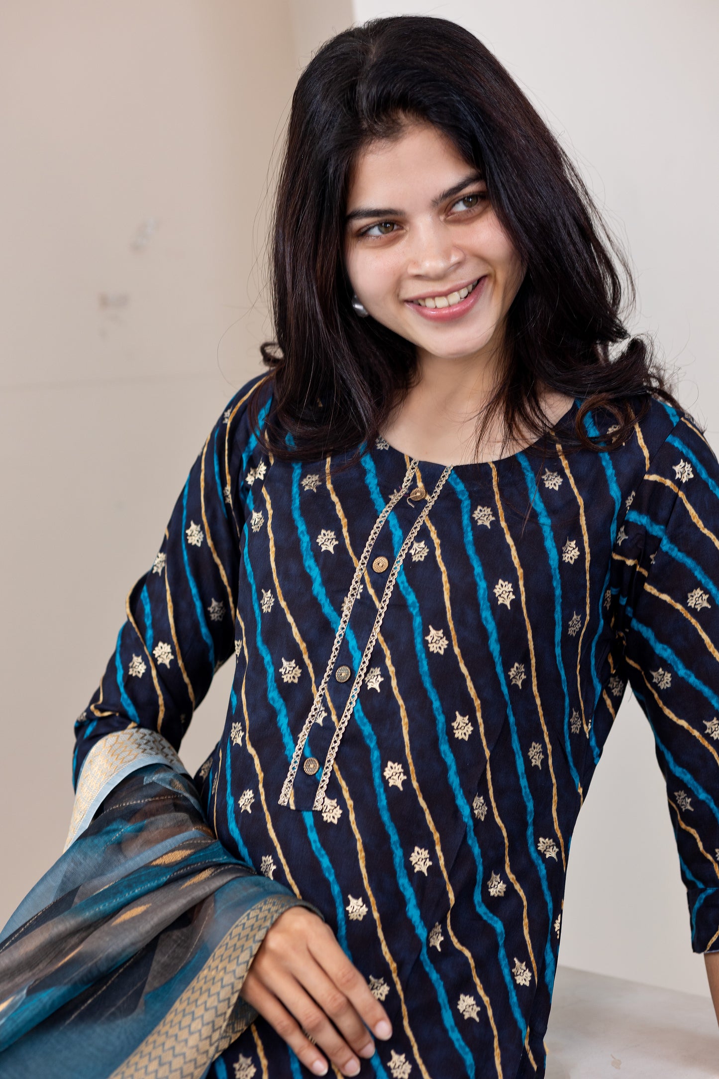 Poonguzhali salwar set in blue with gold printed design