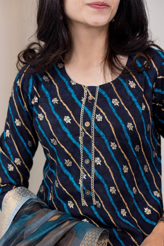 Poonguzhali salwar set in blue with gold printed design