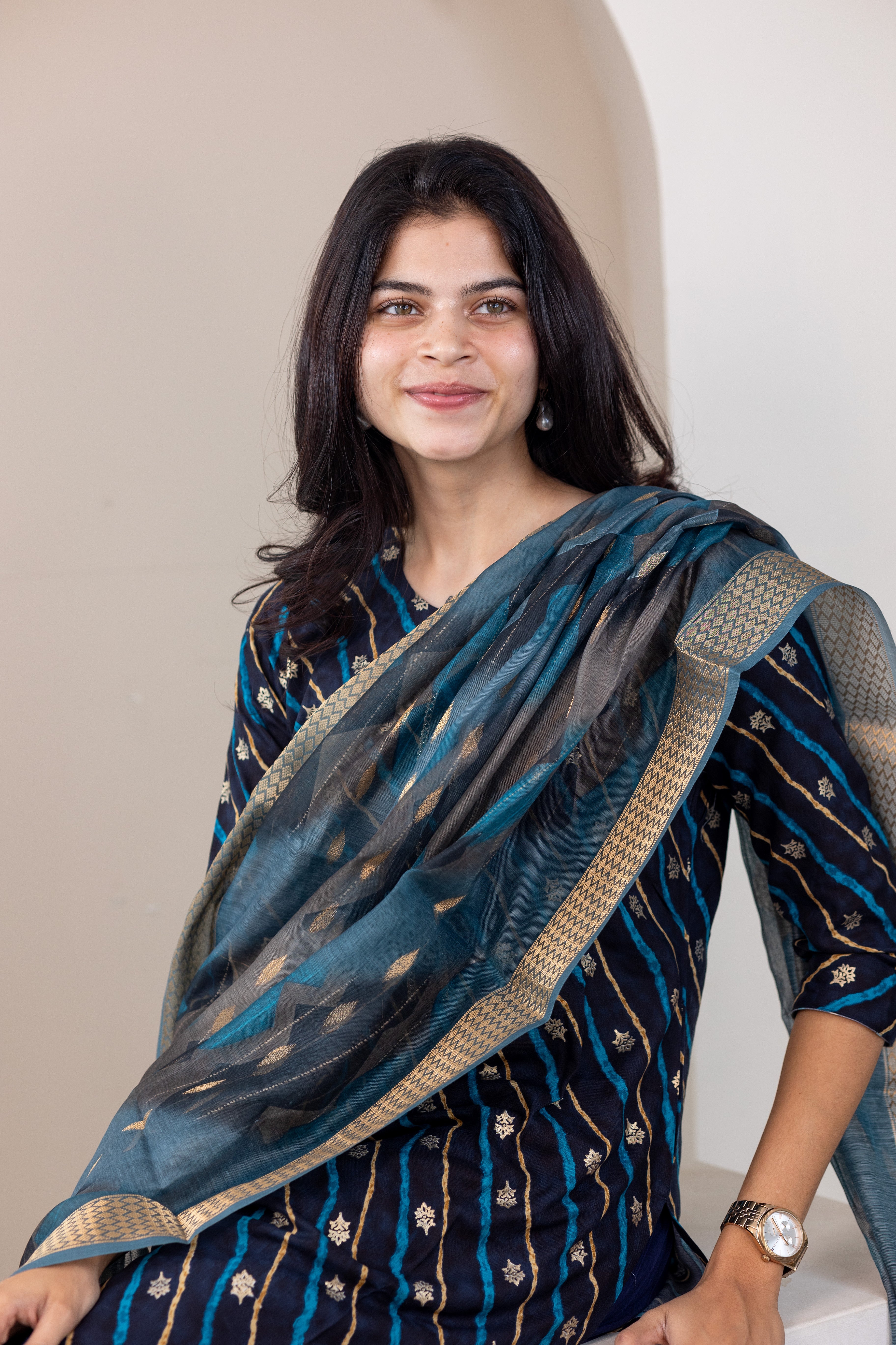 Poonguzhali salwar set in blue with gold printed design