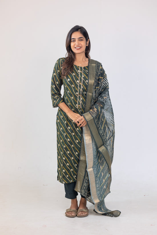 Poonguzhali salwar set in dark green