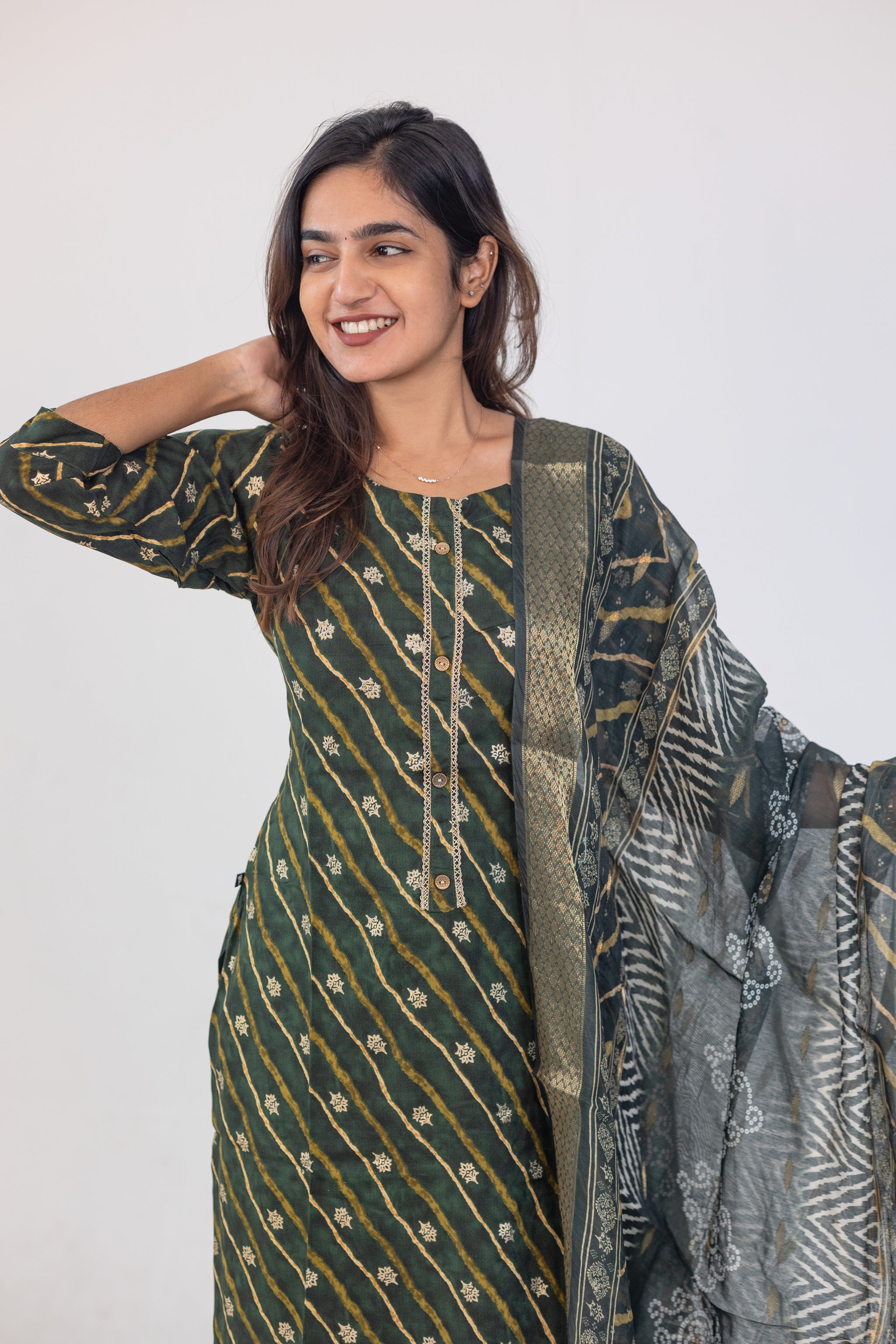Poonguzhali salwar set in dark green