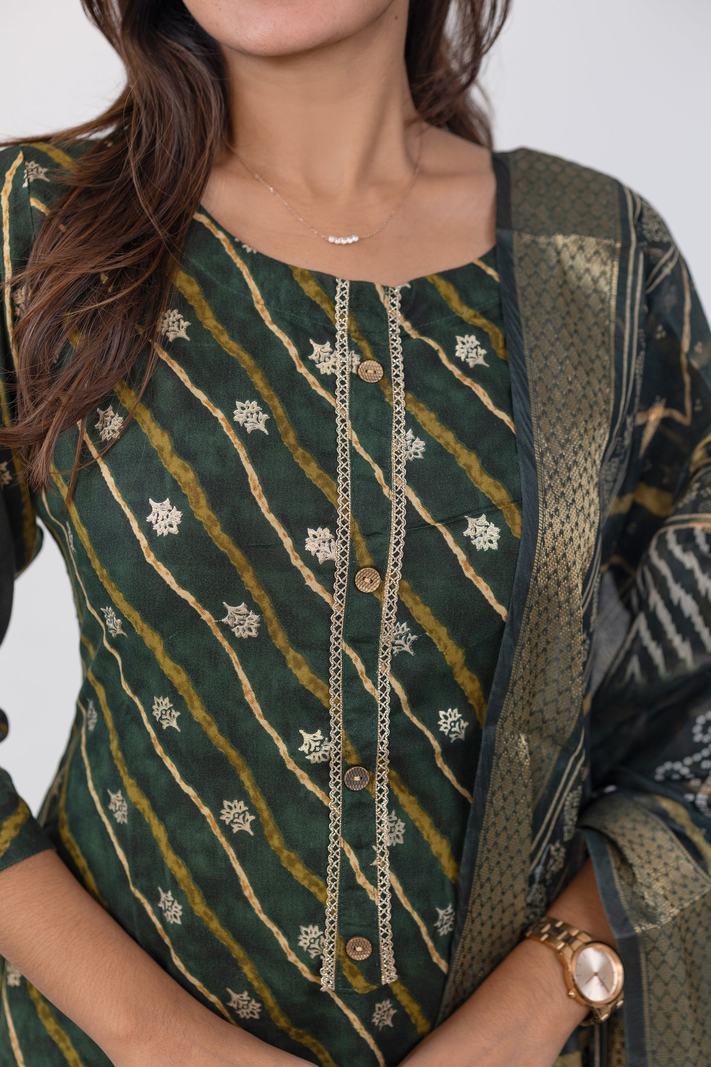 Poonguzhali salwar set in dark green