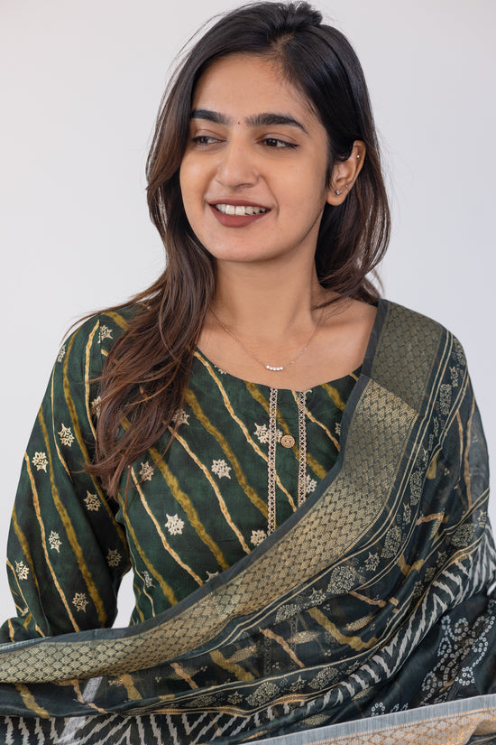 Poonguzhali salwar set in dark green