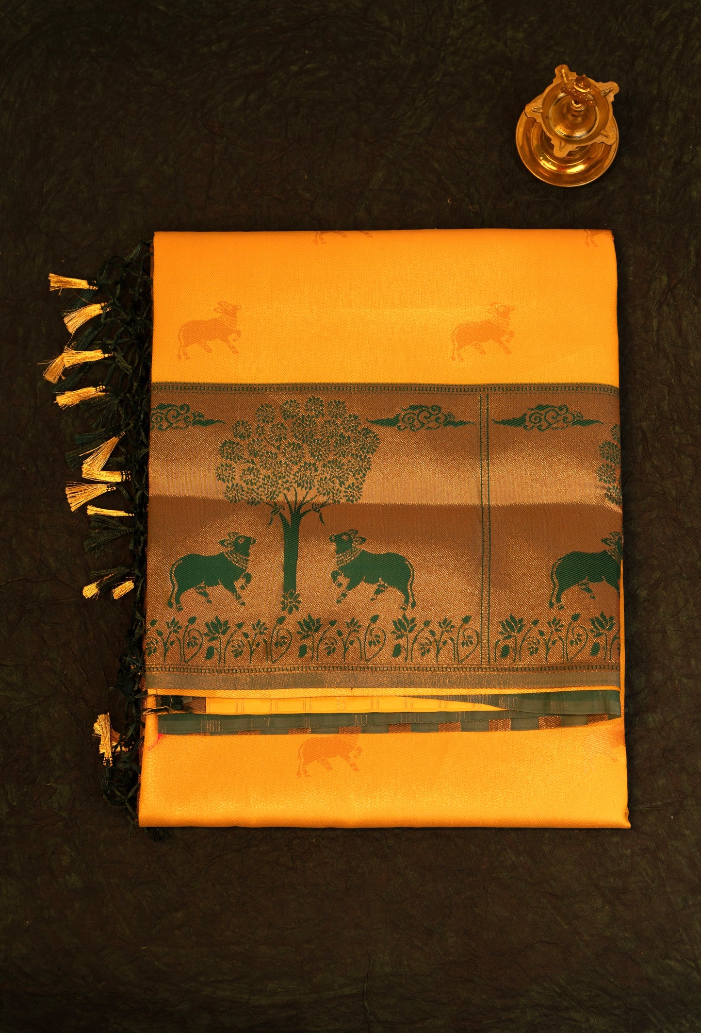Designer saree in Mustard Yellow with Green Zari Border