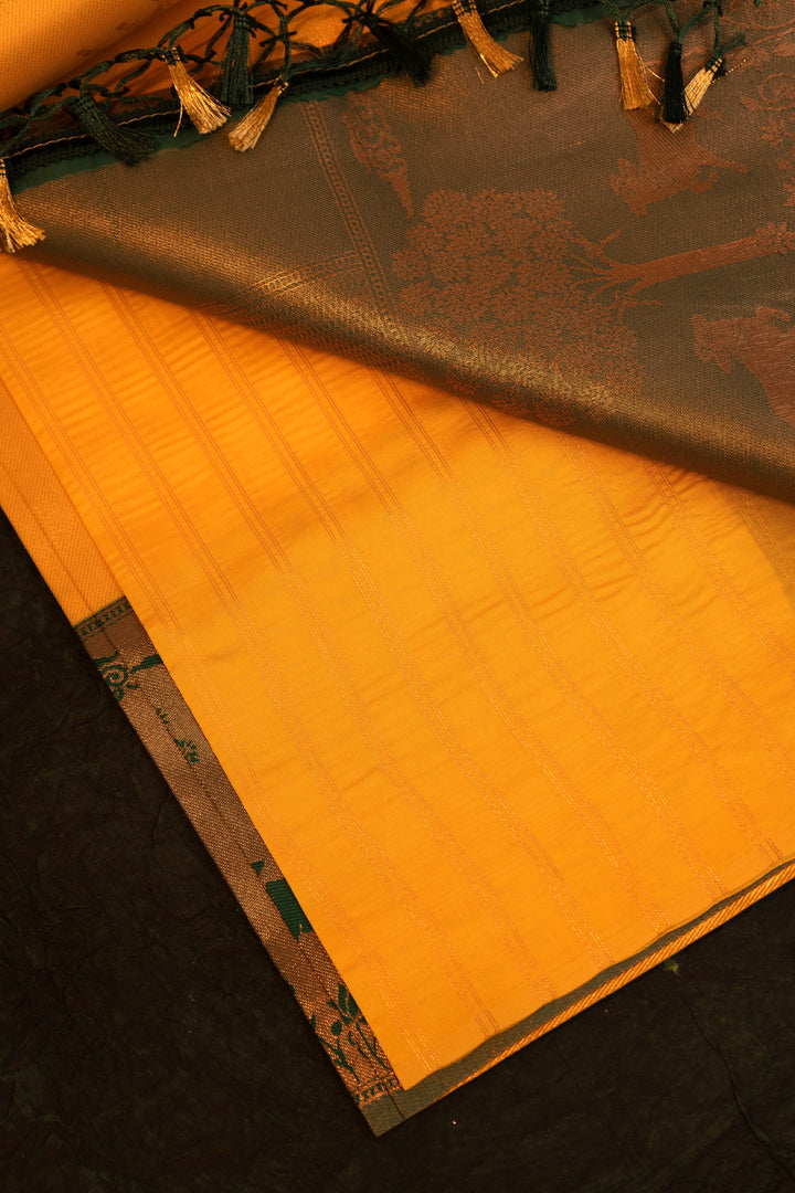 Designer saree in Mustard Yellow with Green Zari Border