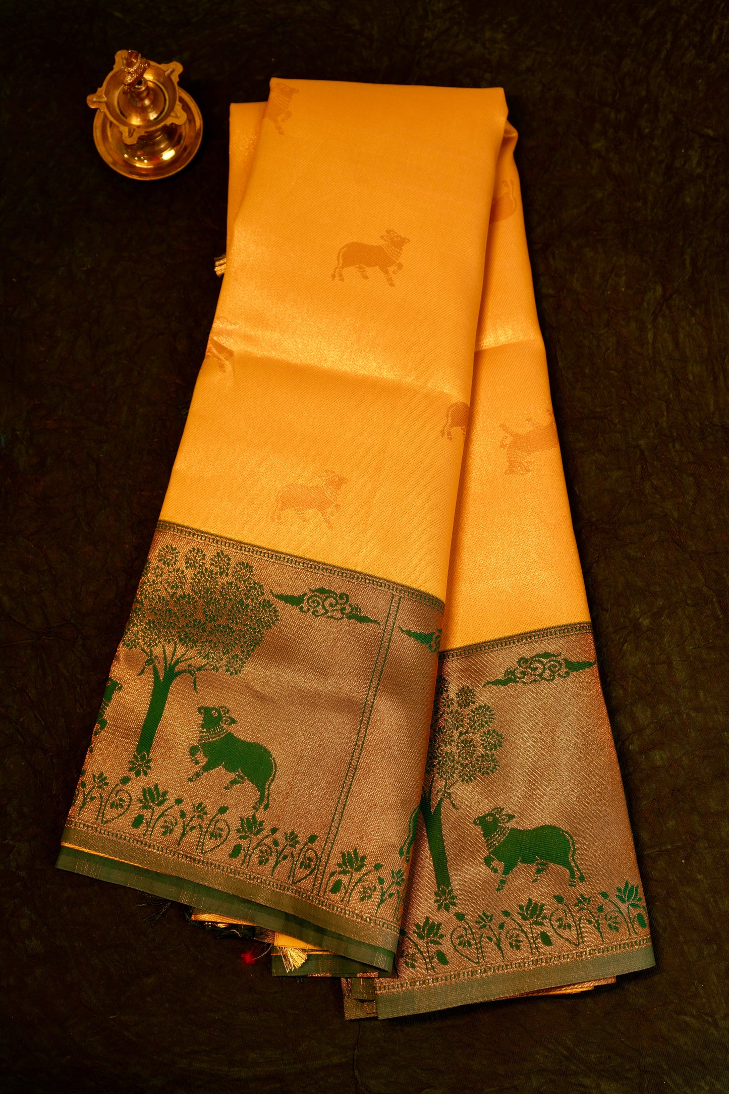 Designer saree in Mustard Yellow with Green Zari Border