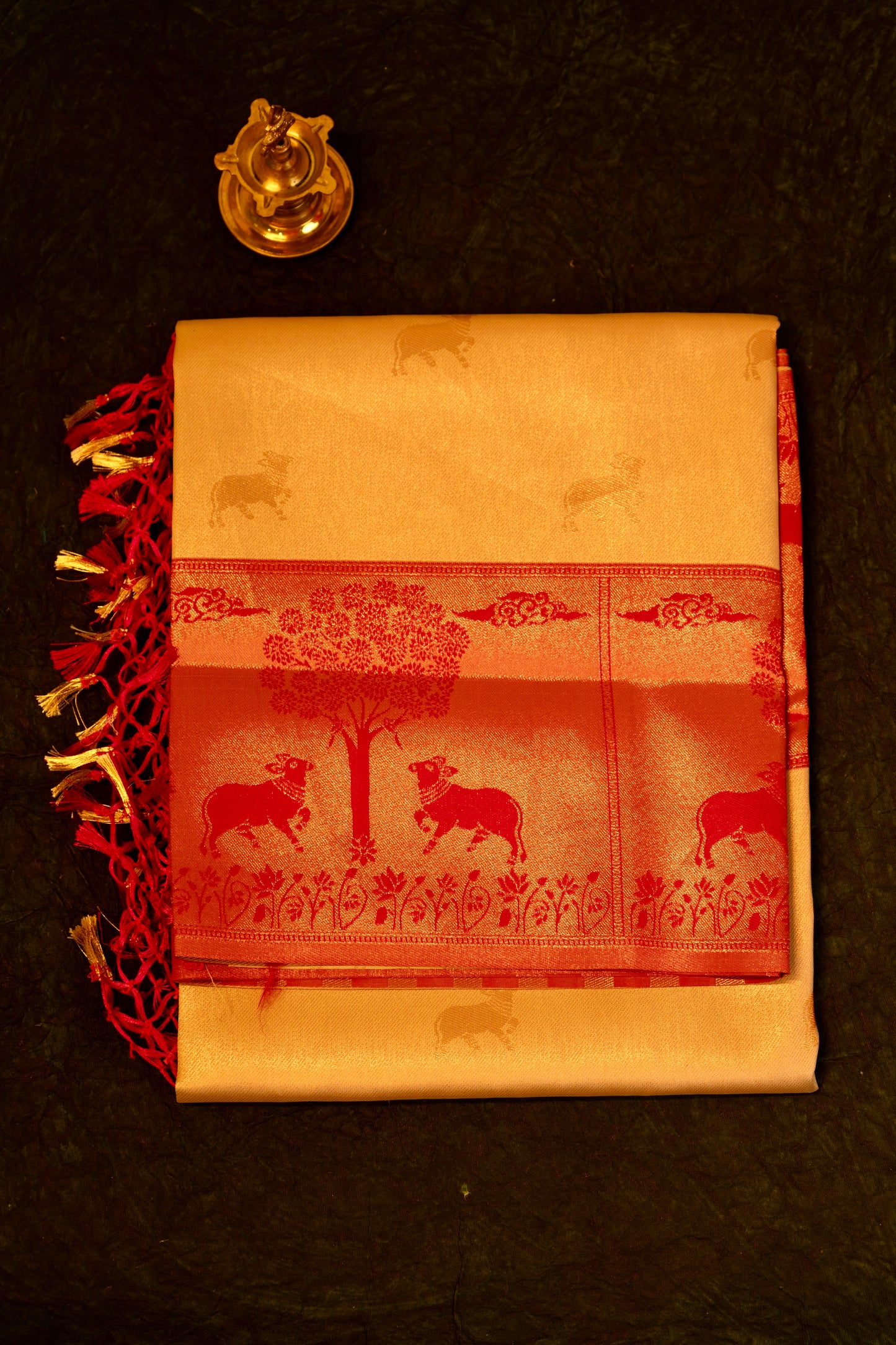 Designer saree in Cream with Red Zari Border