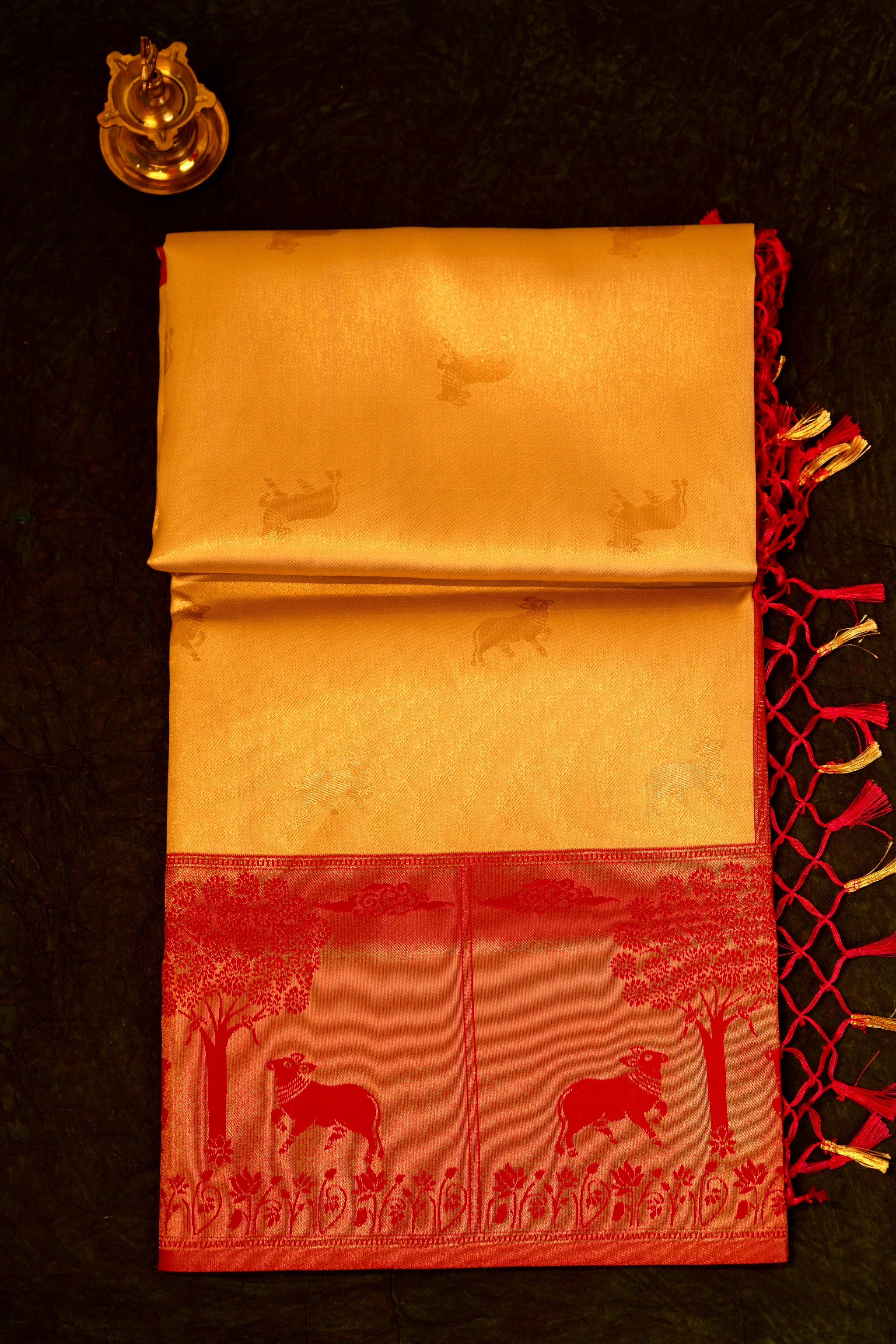 Designer saree in Cream with Red Zari Border