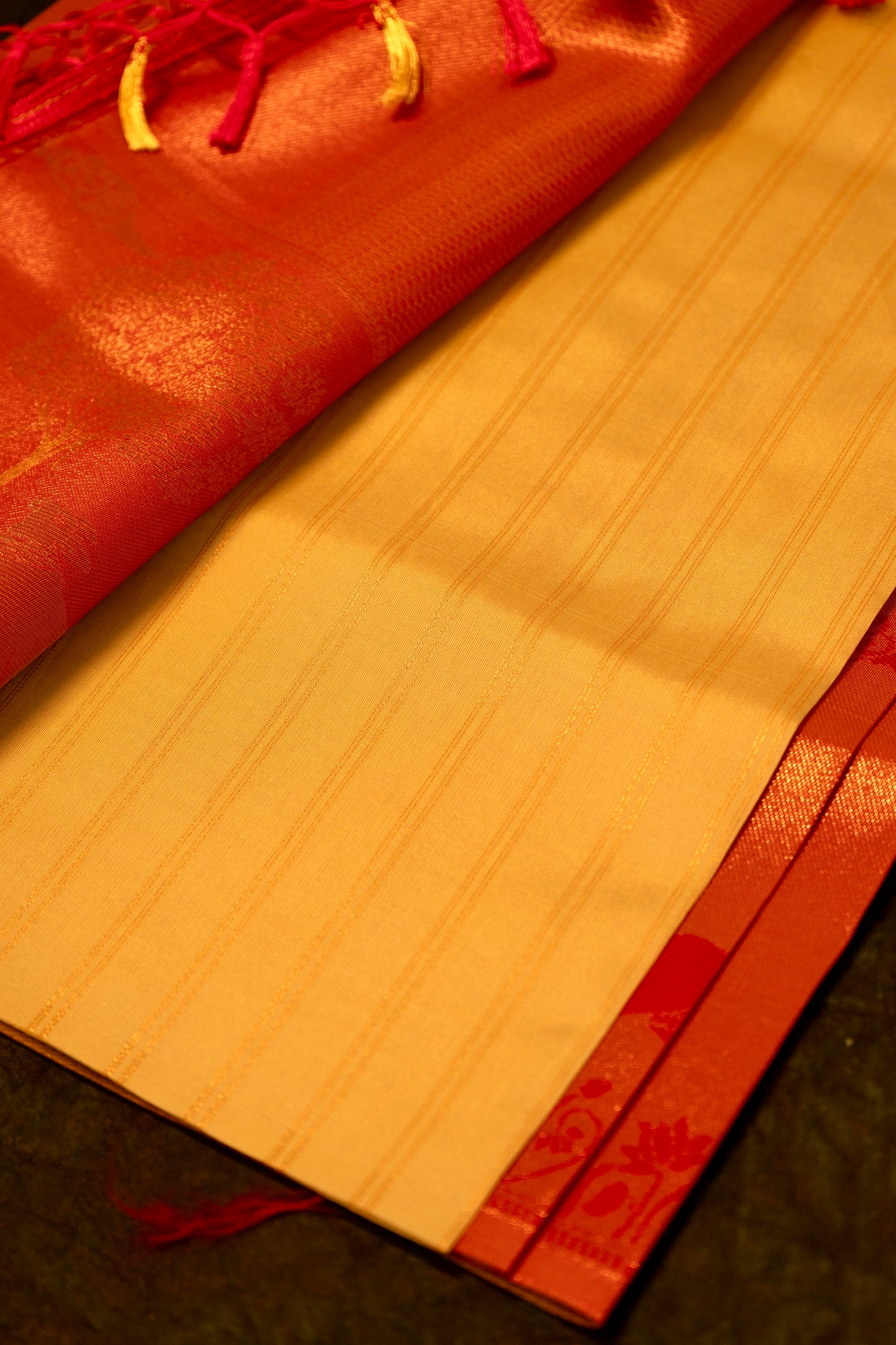 Designer saree in Cream with Red Zari Border