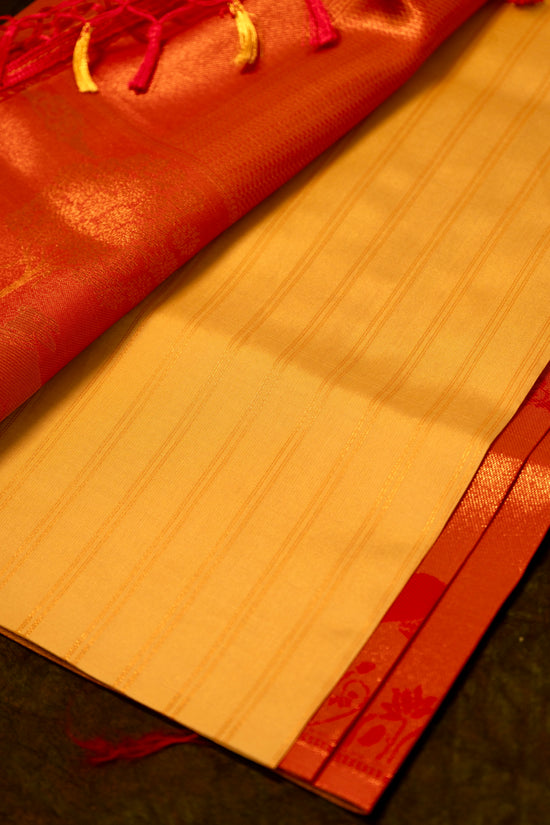 Designer saree in Cream with Red Zari Border