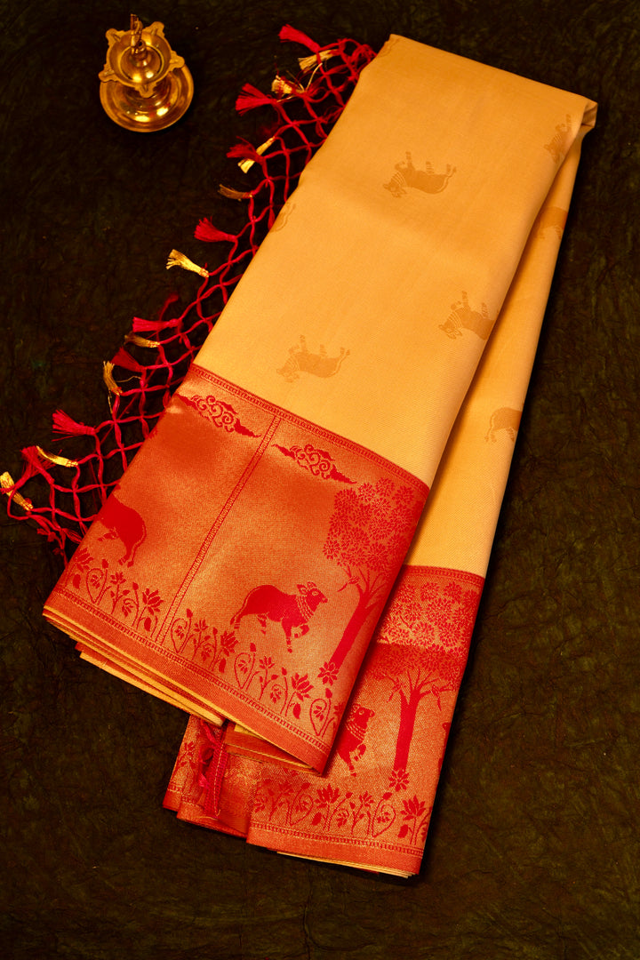 Designer saree in Cream with Red Zari Border