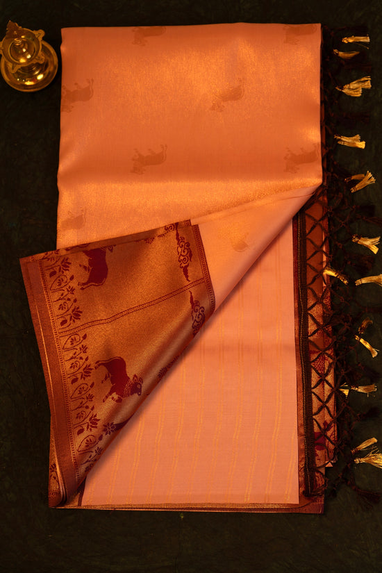 Designer saree in Peach with Maroon Zari Border