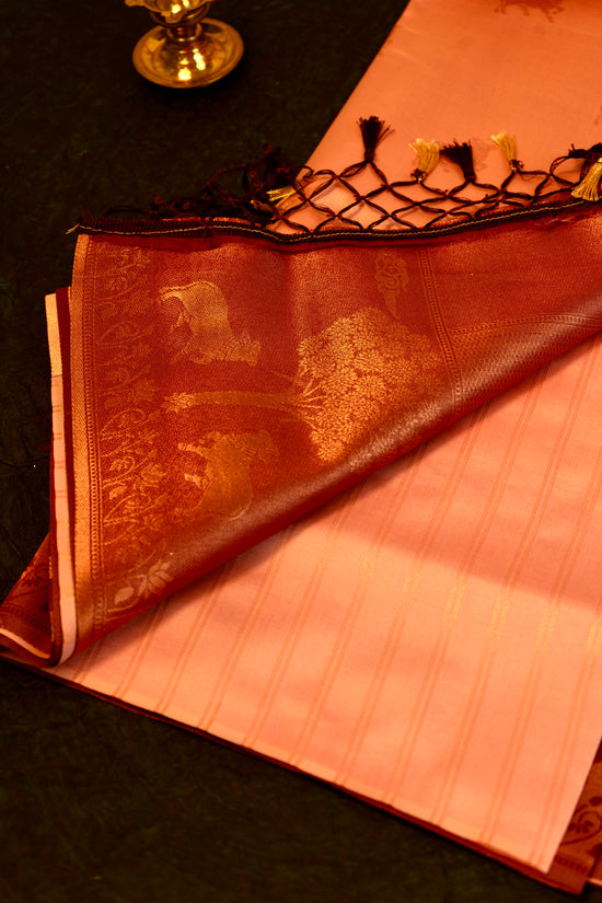 Designer saree in Peach with Maroon Zari Border