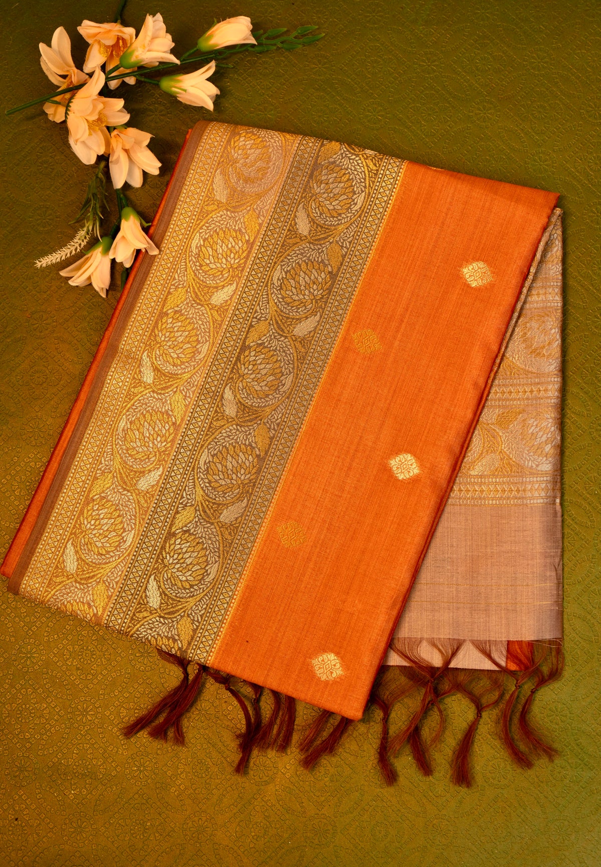 Soft silk  saree in orange with Gold Zari Border