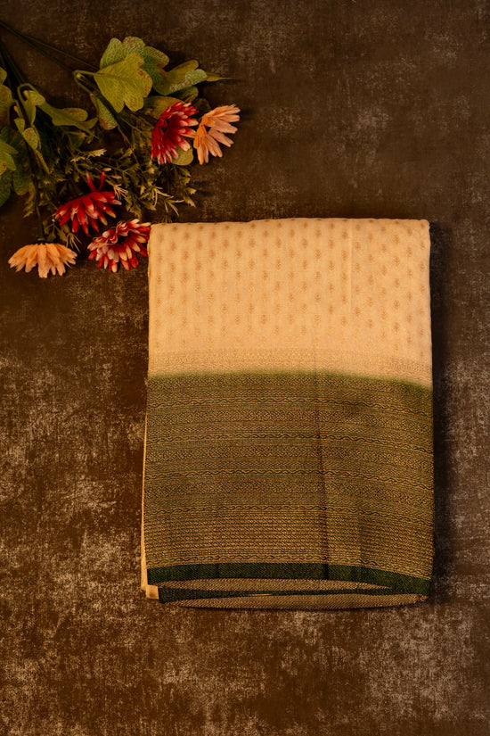 Tissue georgette saree in offwhite and dark green with silver zari