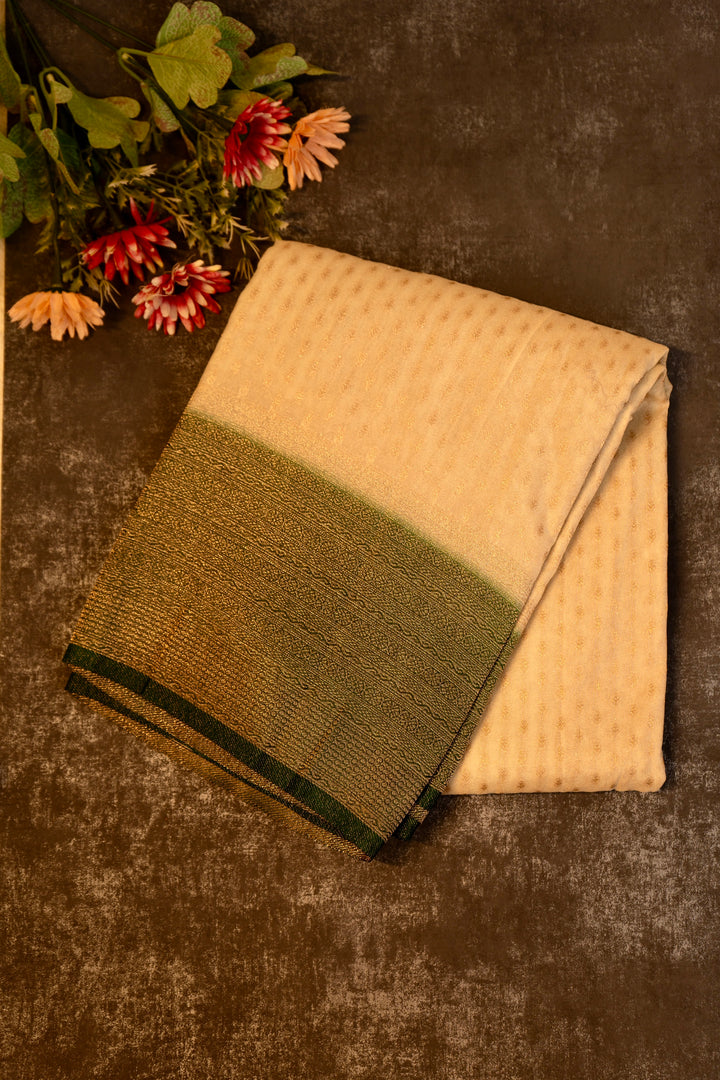 Tissue georgette saree in offwhite and dark green with silver zari