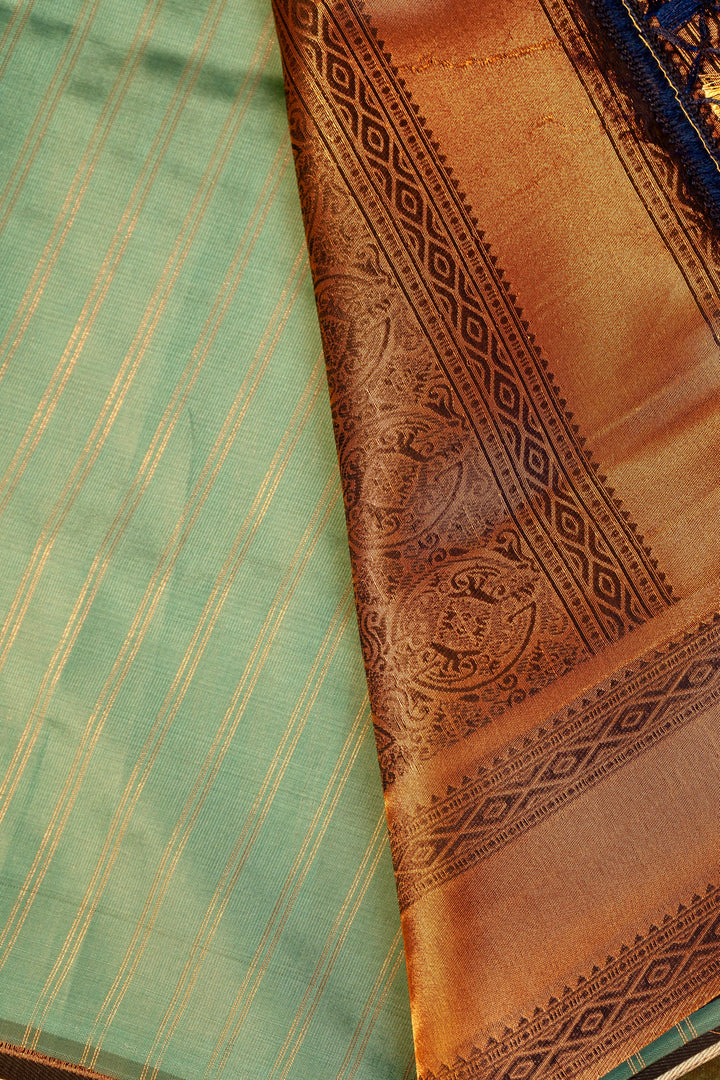 Designer saree in pista pastel green with gold zari