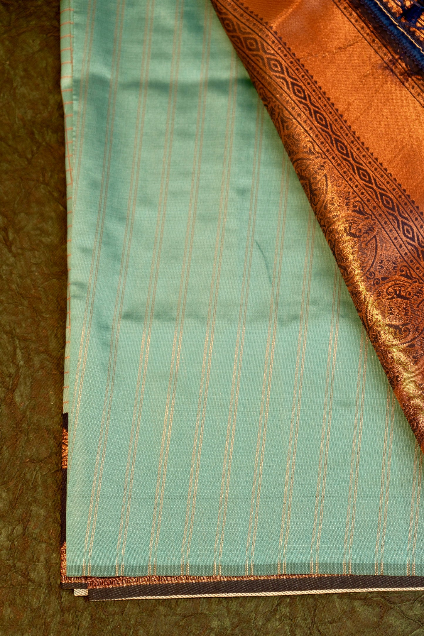 Designer saree in pista pastel green with gold zari