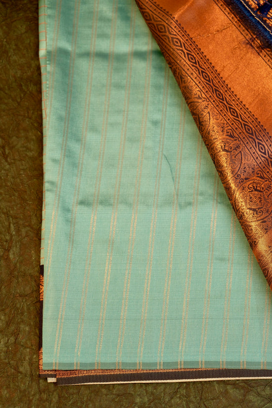Designer saree in pista pastel green with gold zari