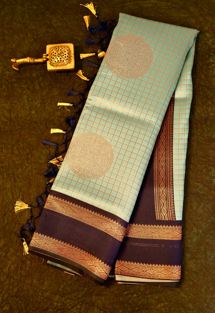 Designer saree in pista pastel green with gold zari