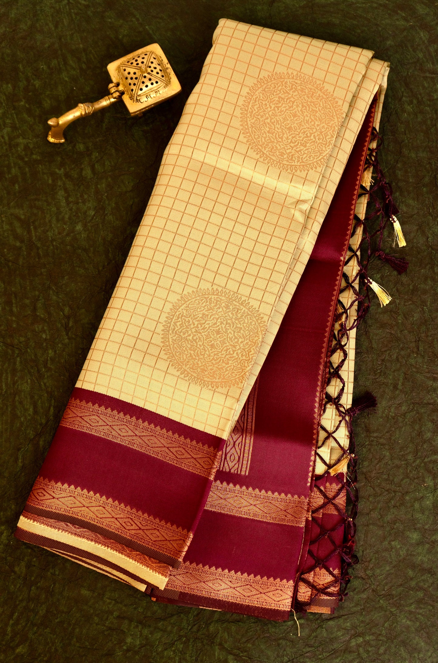 Designer saree in pale yellow with gold zari