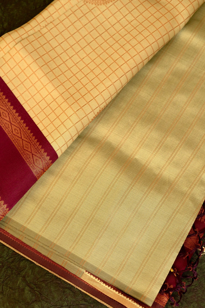 Designer saree in pale yellow with gold zari