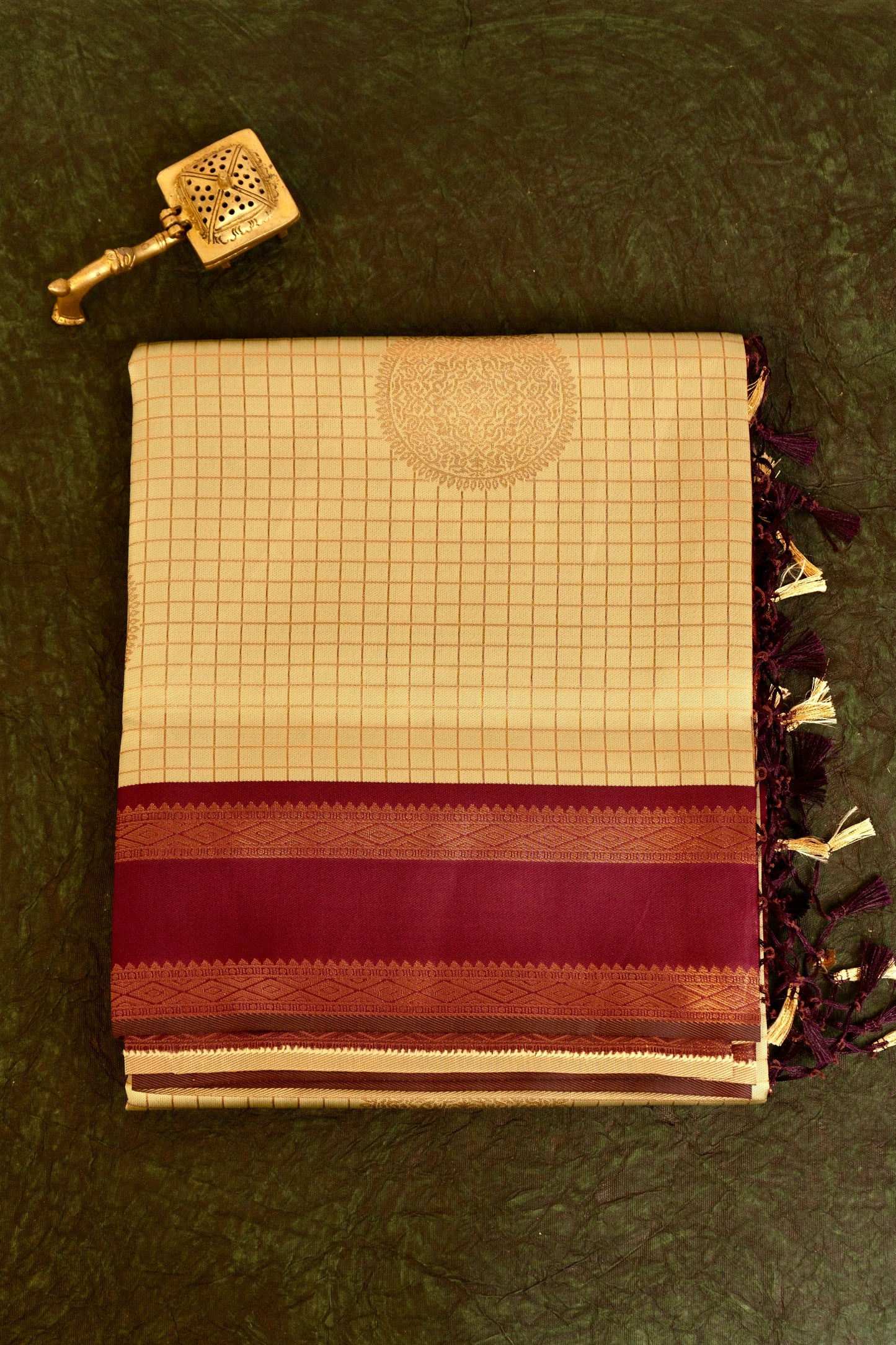Designer saree in pale yellow with gold zari