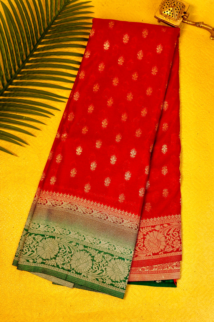 Designer saree in red with woven green motifs