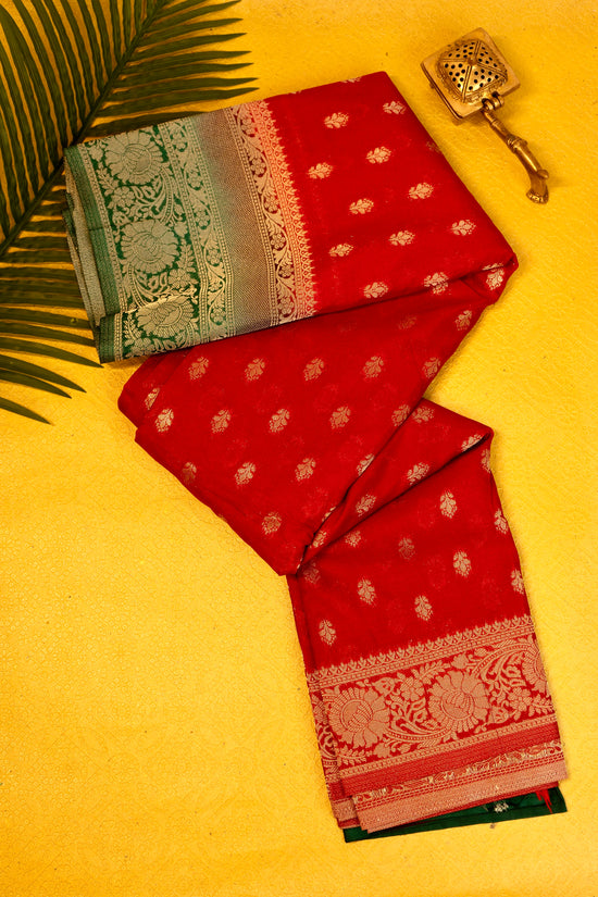Designer saree in red with woven green motifs