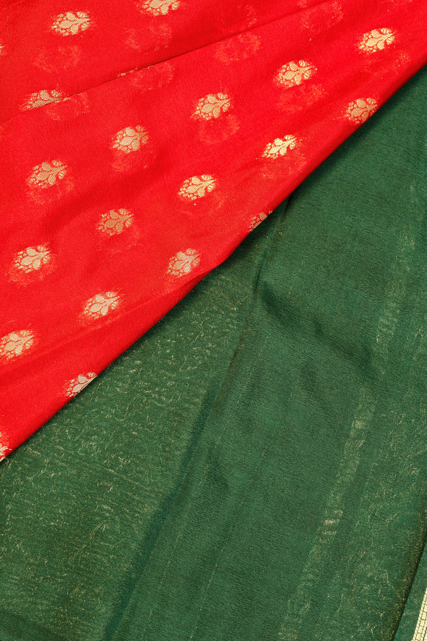 Designer saree in red with woven green motifs