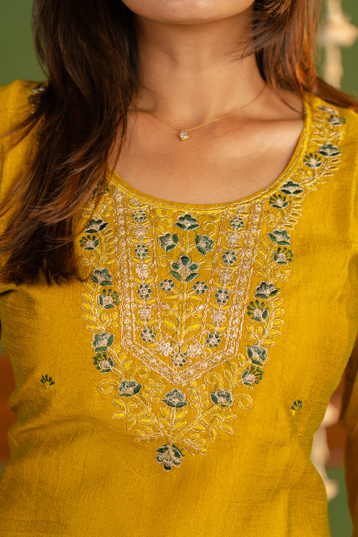 Meenakshi kurti in mustard yellow with green and gold embroidery